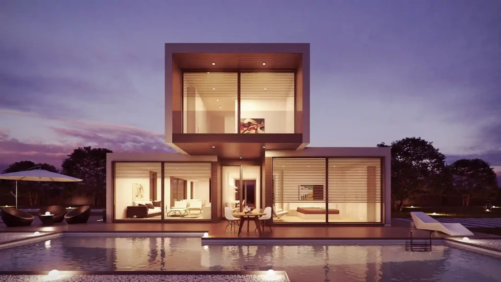 Modern house with large glass windows, illuminated at dusk, reflecting on a calm pool, demonstrating the high-quality visualization achievable with the best rendering software.